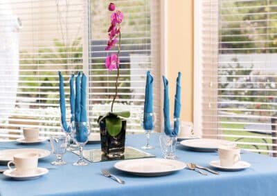 A set dining table with decorative flower