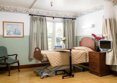 Guest bedroom with bed and windows